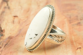 White Buffalo Turquoise set in Sterling Silver Ring. This Beautiful Stone is formed from the minerals Calcite and Iron. It is mined near Tonopah Nevada. Created by Navajo Artist Phillip Sanchez. Signed.